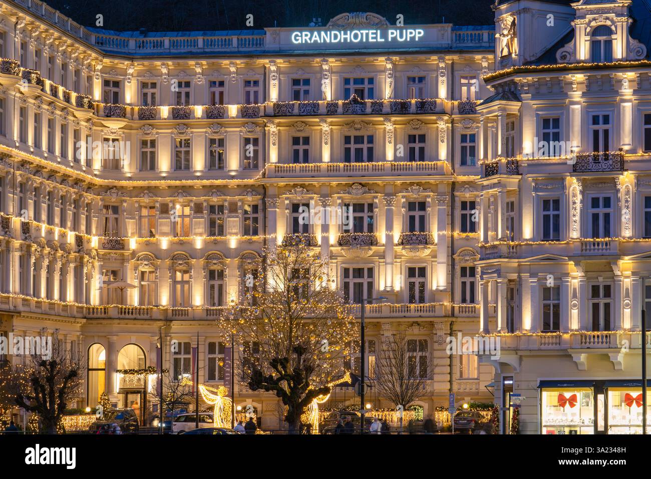 This is a night view of Grandhotel Pupp, a famous luxury spa hotel along the riverside in the town centre on December 23, 2024 in Karlovy Vary, Czech Stock Photo