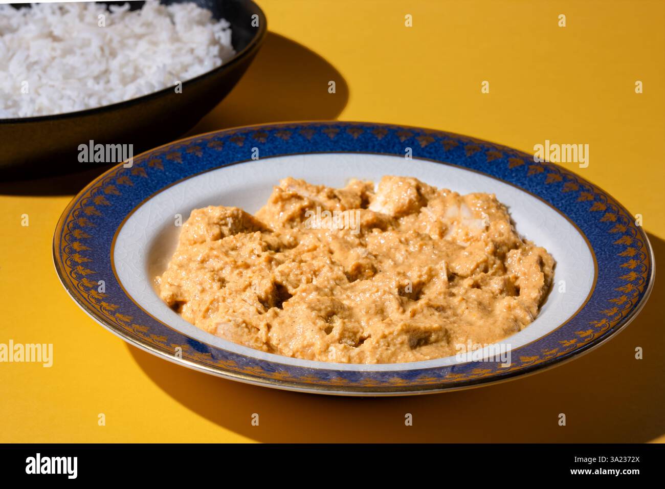 UK. A homemade Indian chicken pasanda curry served with fresh boiled basmati rice. Stock Photo
