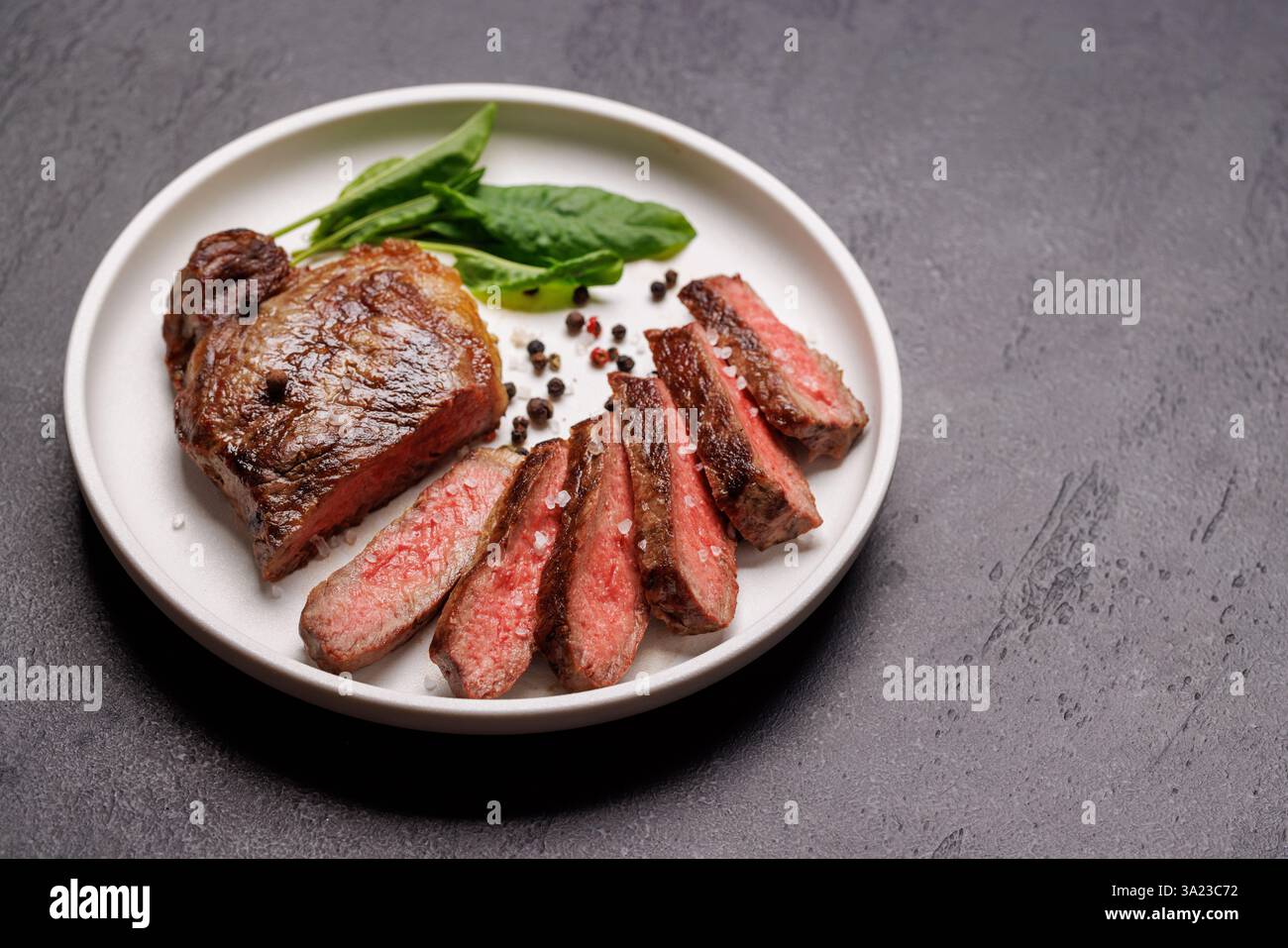 Cooked Textr A perfectly cooked sliced striploin steak with a juicy, tender texture ...