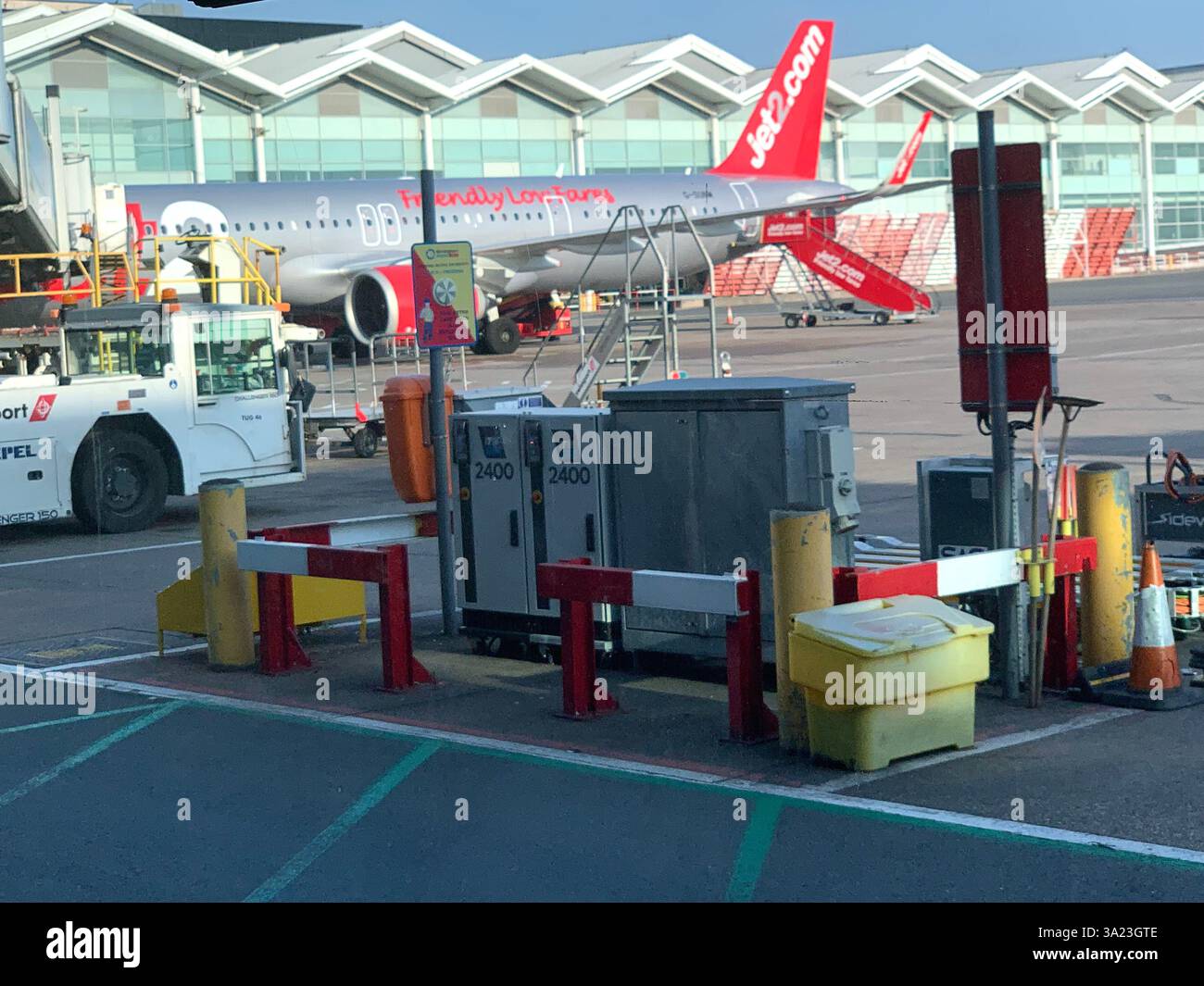 Jet 2 in flight trolley airliner passengers passenger staff working sell selling goods tea beer drink food Birmingham Police Policeman waiting sit sat - Smartphone Captured Stock Image