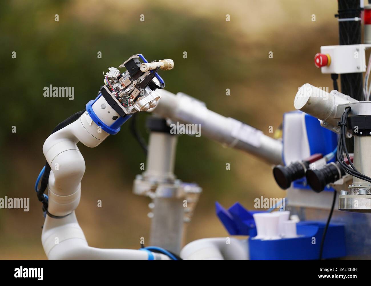 The robotic arm of the four-wheeled Mars rover (known as Codi) as it ...