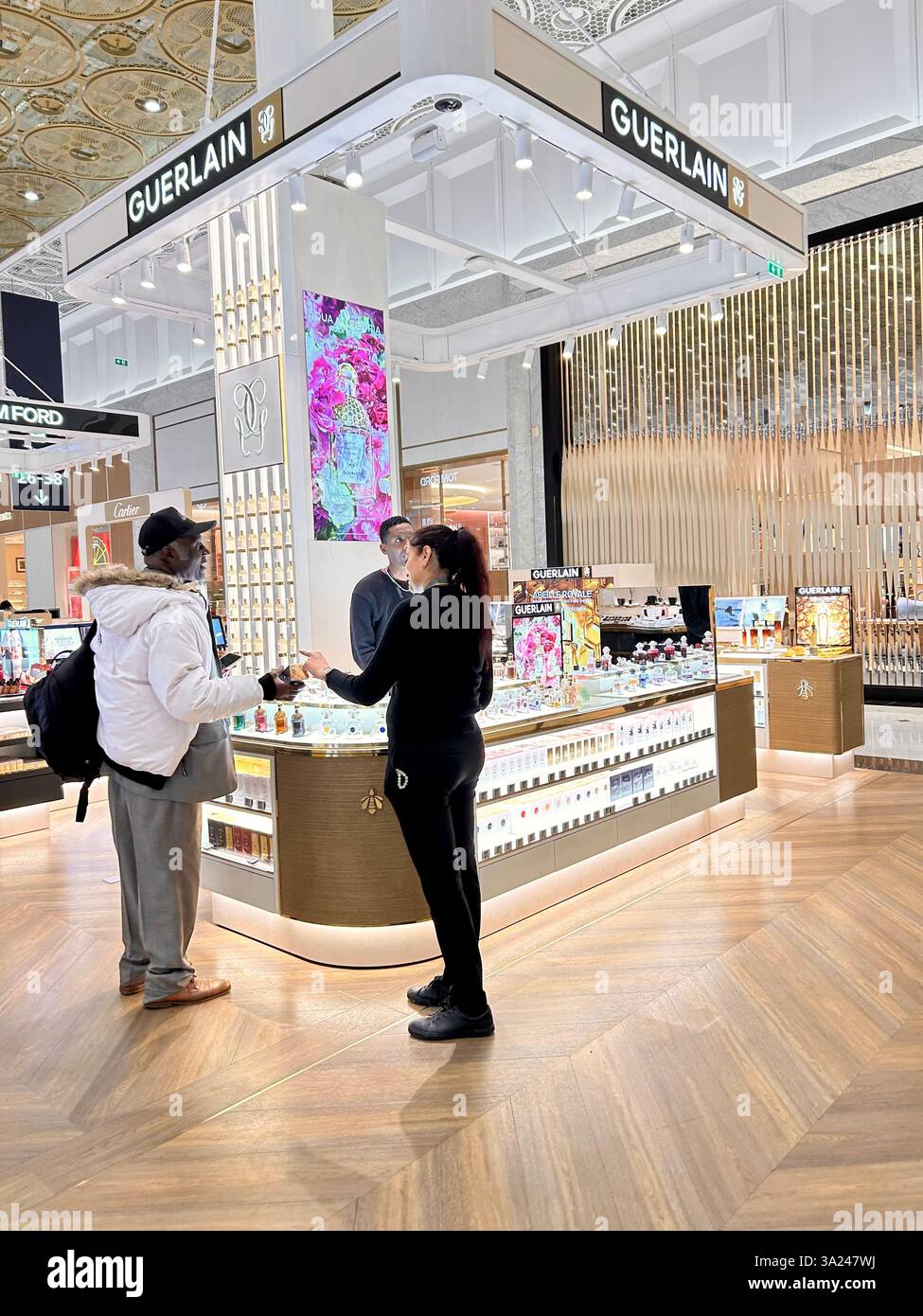 Roissy Airport, Paris, France, Saleswoman talking to client, Luxury Shops in Shopping Center, Guerlain Perfume Counter, LVMH store in Paris - Smartphone Captured Stock Image