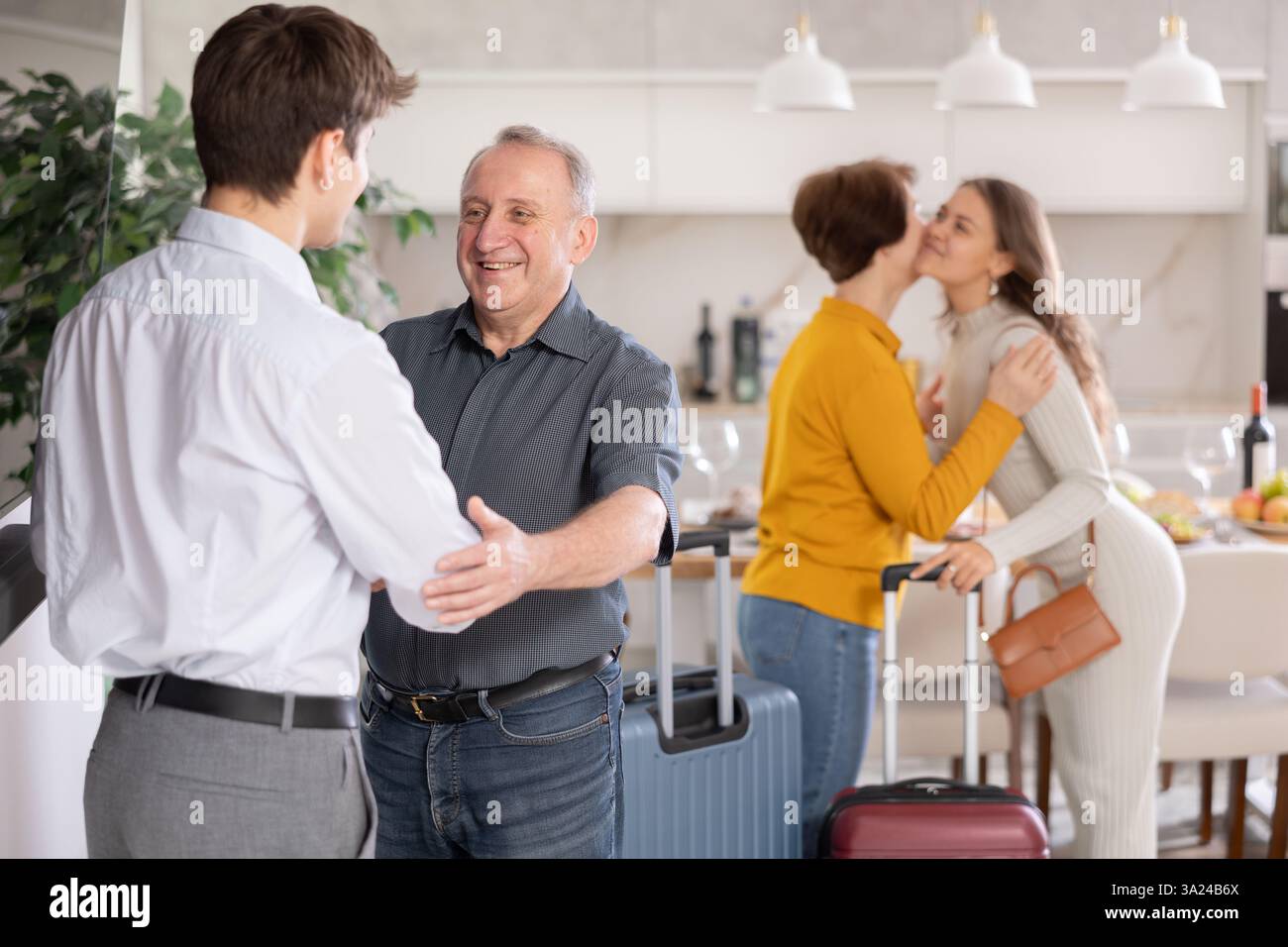 Son welcoming senior man hi-res stock photography and images - Alamy