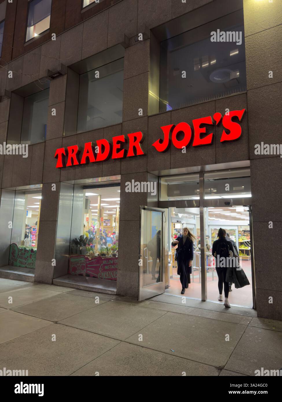 Trader Joe's grocery store, building exterior and entrance at night ...