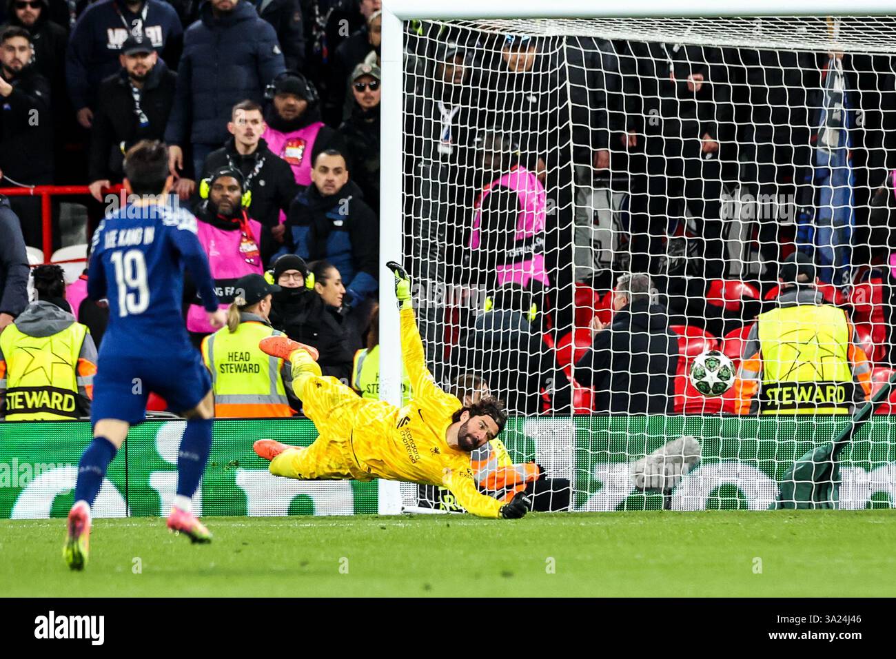 Alisson Becker of Liverpool makes a save during the UEFA Champions ...