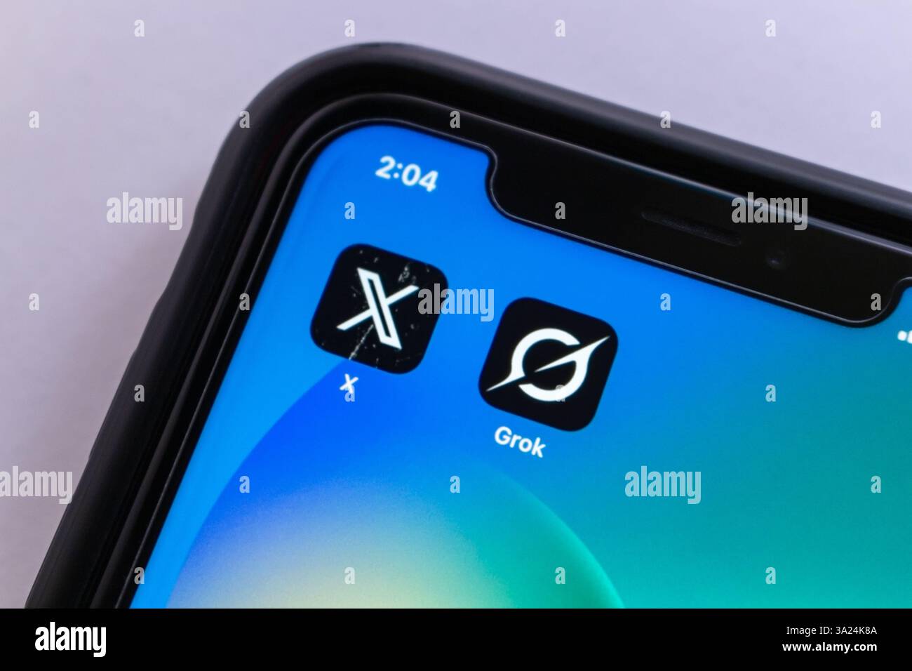 Mexico City, MEXICO - Mar 11 2025 : X app and Grok displayed on an iPhone screen, symbolizing modern AI-driven social media and technology. Stock Photo