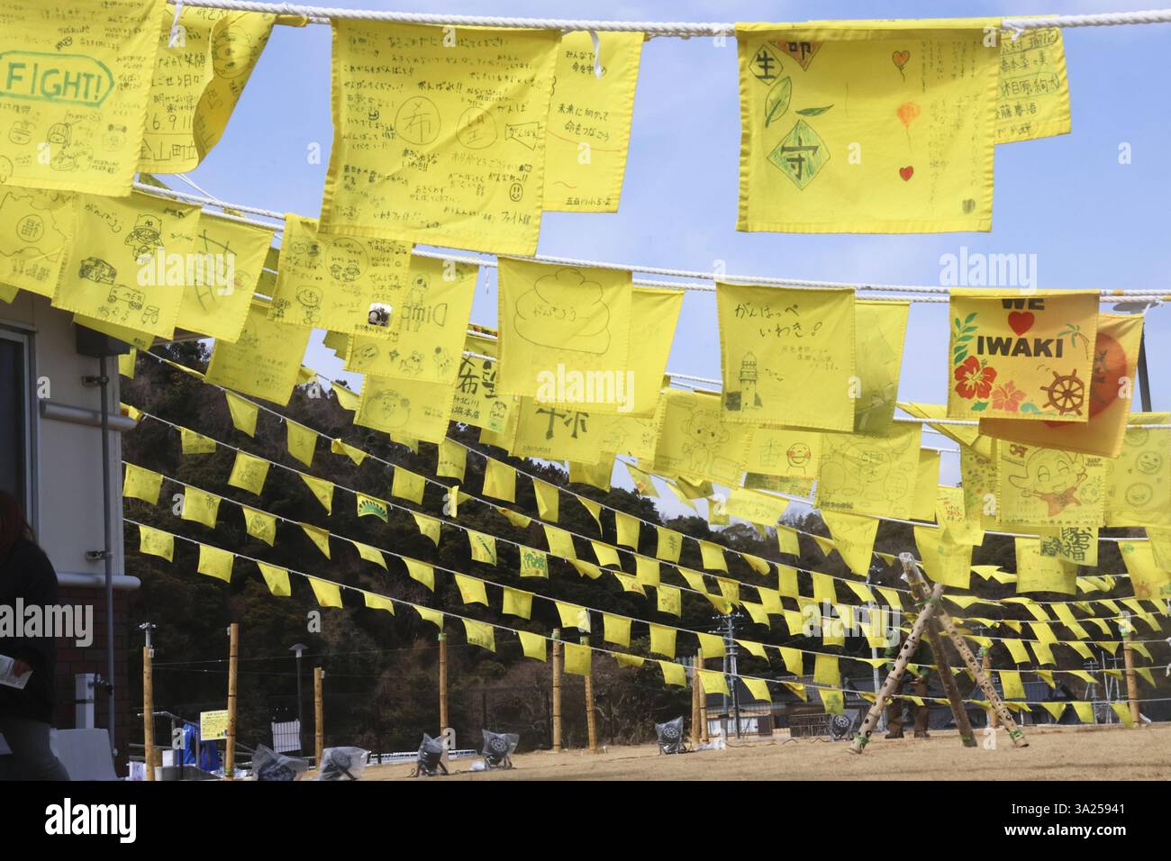 About 300 yellow handkerchiefs with written messages hang on ropes in ...