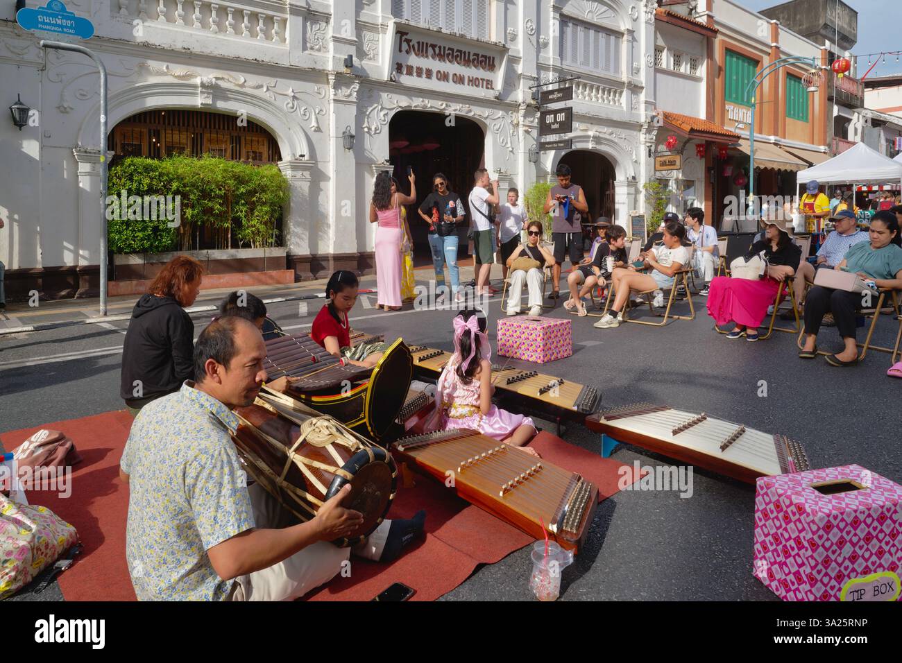A traditional Thai orchestra playing at the Sunday street market in ...