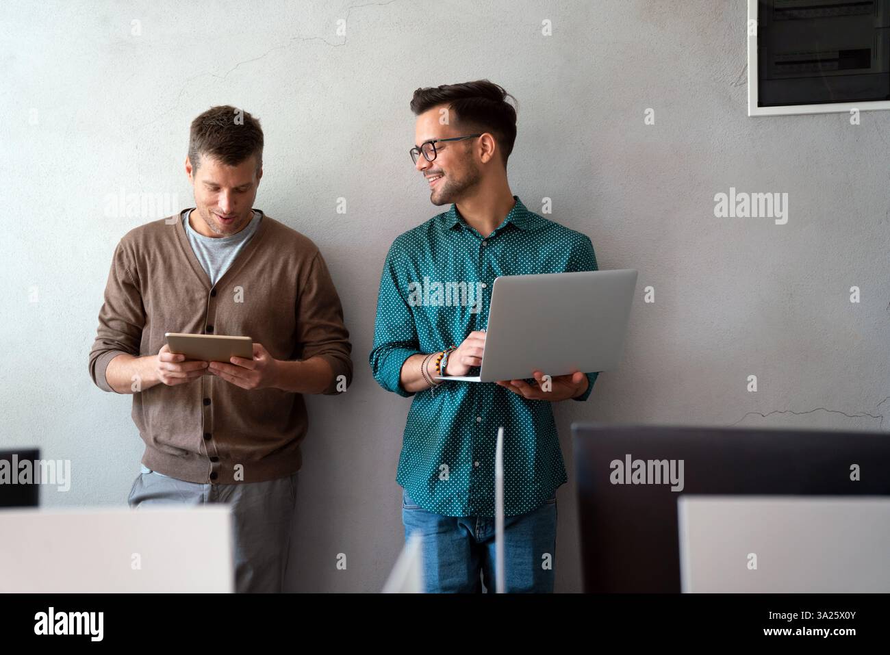 Programmers working in a software developing company office Stock Photo