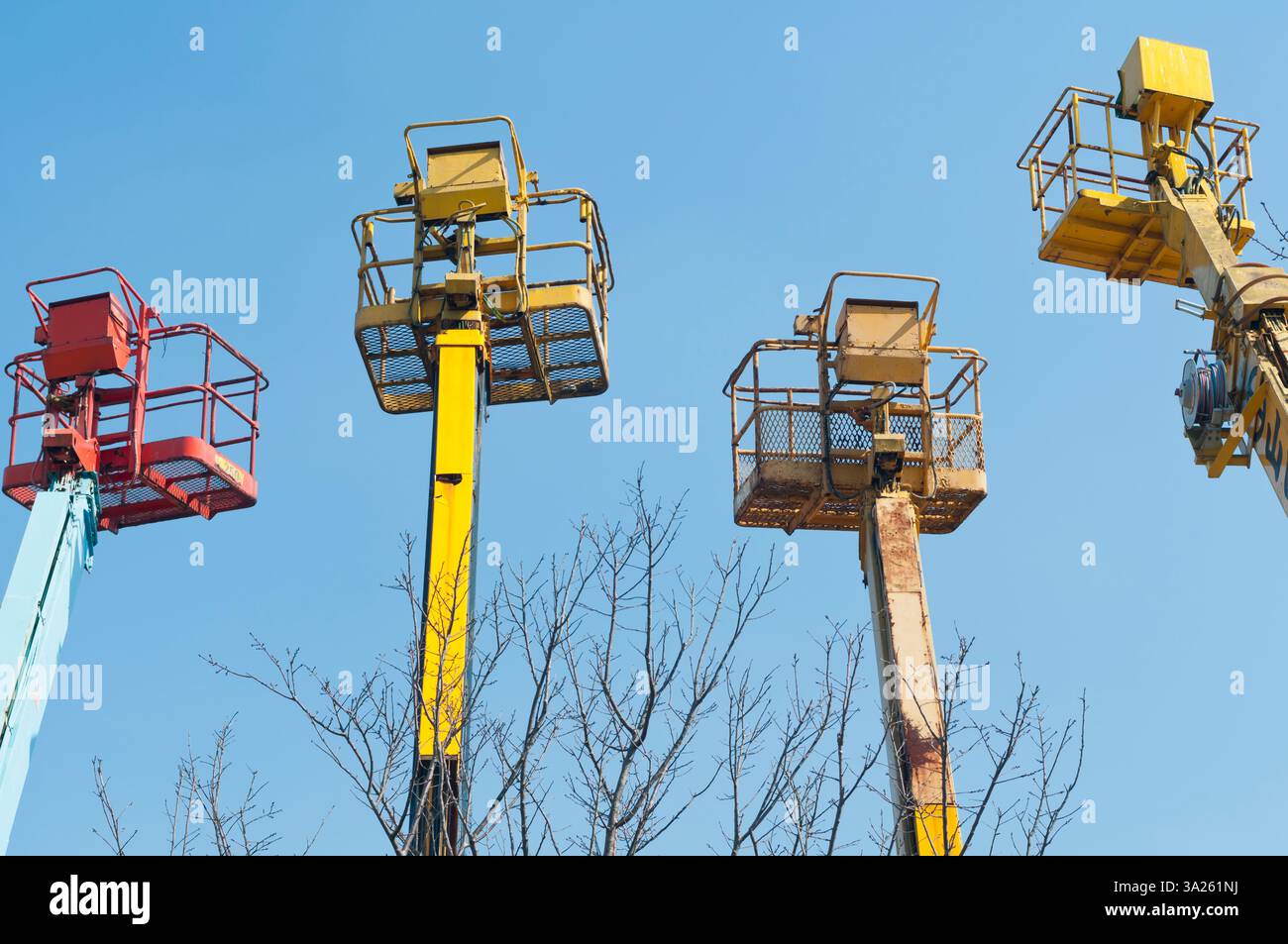 A group of mobile cranes with hooks and pulleys, dockyard lifting ...