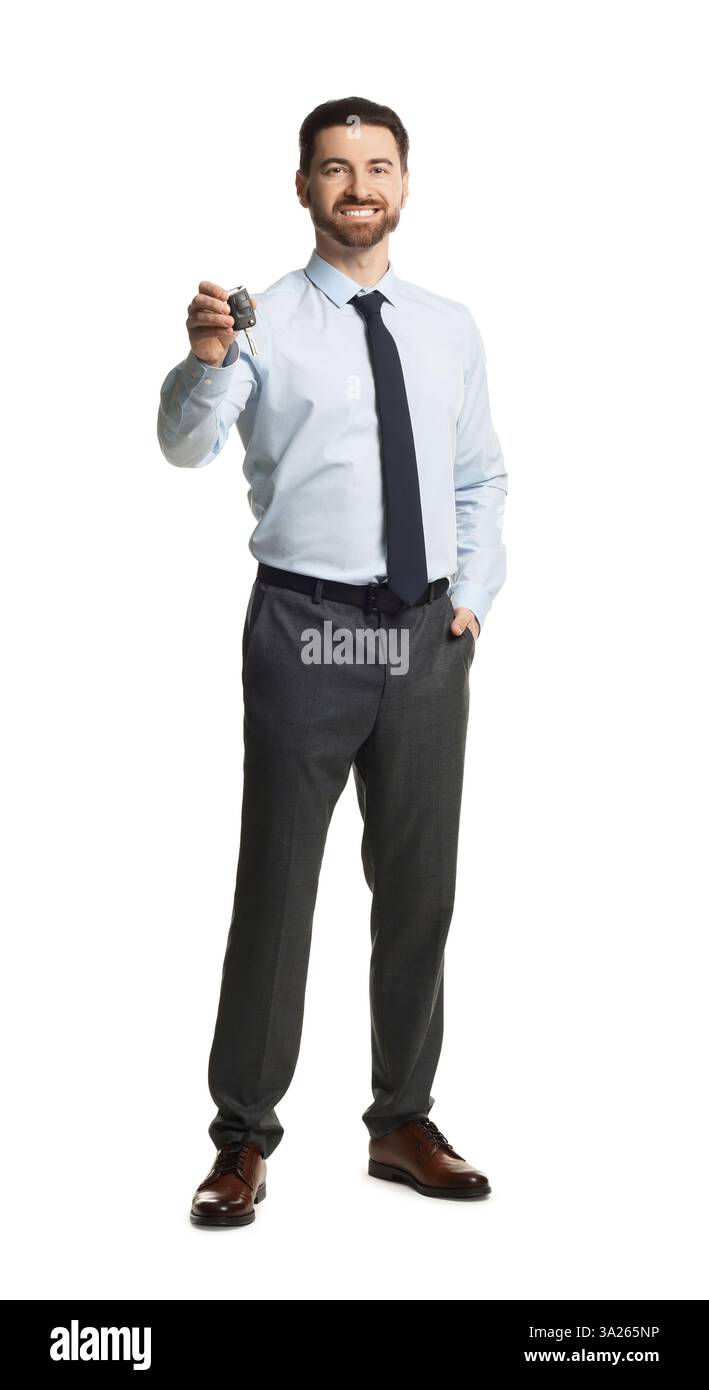 Cheerful salesman with car key on white background Stock Photo - Alamy