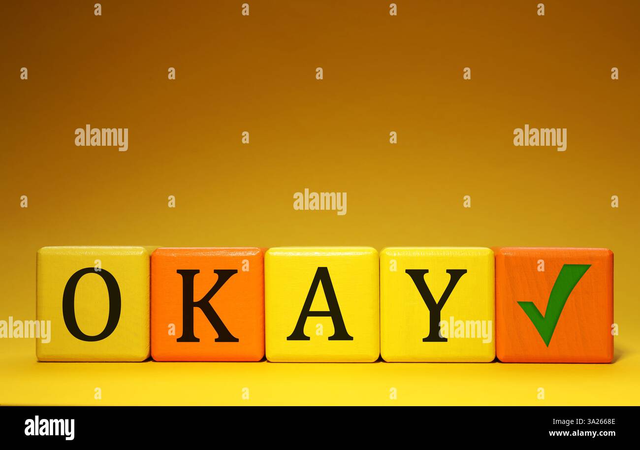 Colorful cubes with word Okay and check mark on color background Stock ...