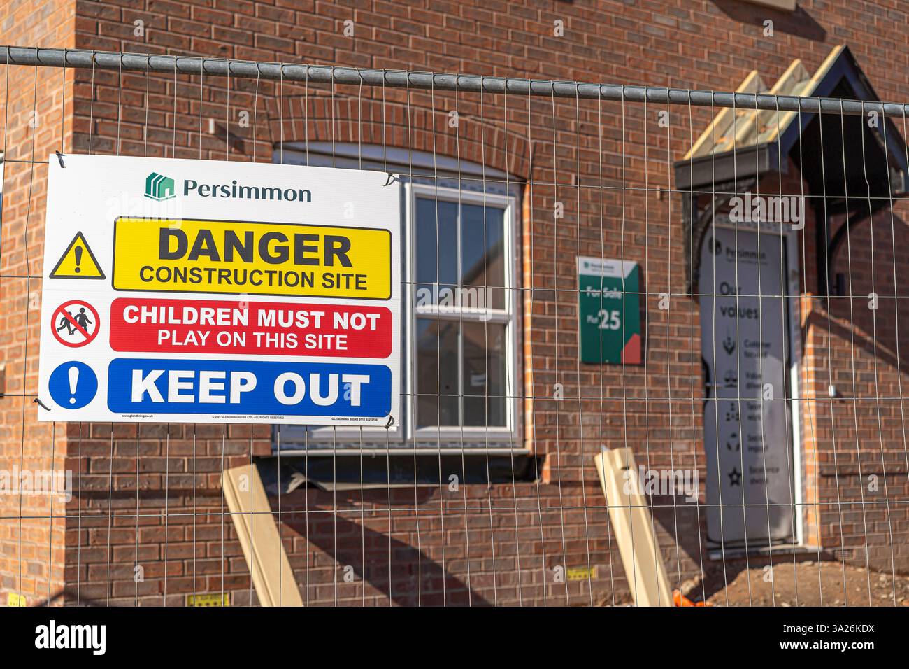 Persimmon house builders sign on a building site fence explaining that ...