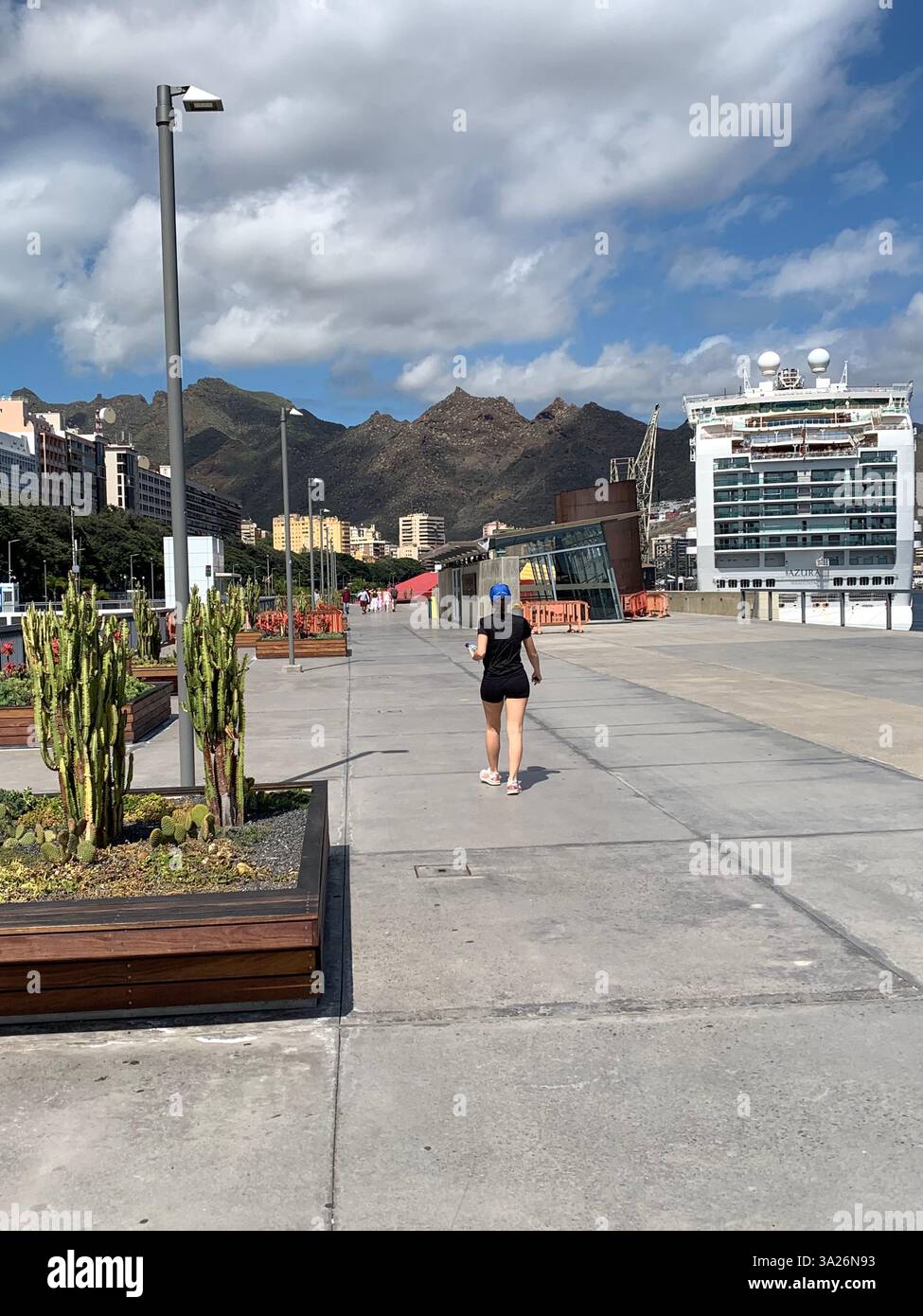 Santa Cruise Tenerife Canary Islands Spain port sign signs beer drink name statue mother and child  cactus outside ship boat cruise liner mountains - Smartphone Captured Stock Image