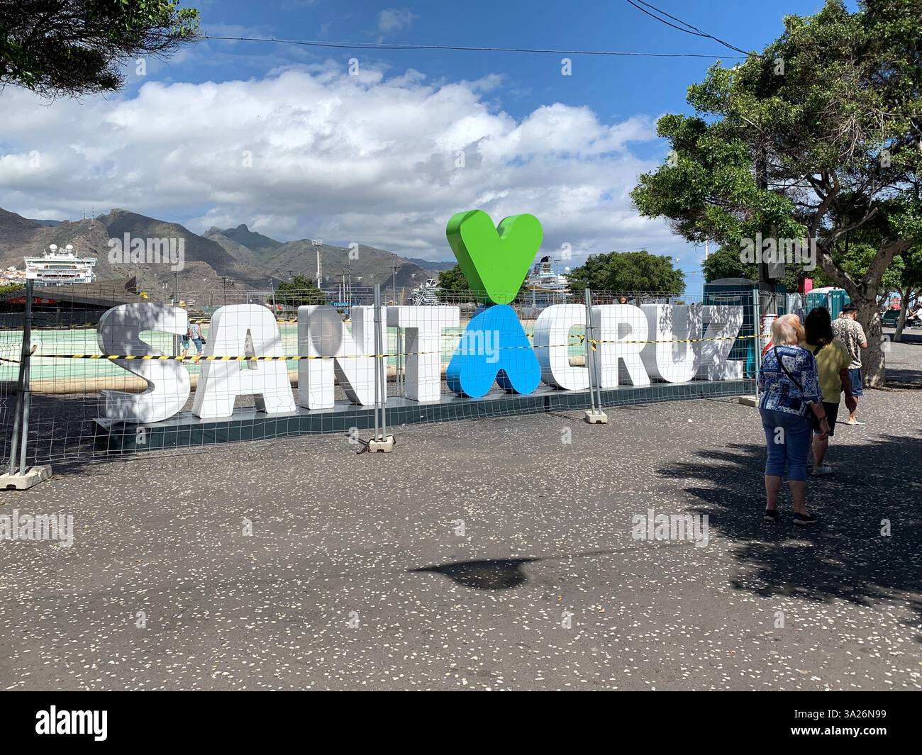 Santa Cruise Tenerife Canary Islands Spain port sign signs beer drink name statue mother and child  cactus outside ship boat cruise liner mountains - Smartphone Captured Stock Image