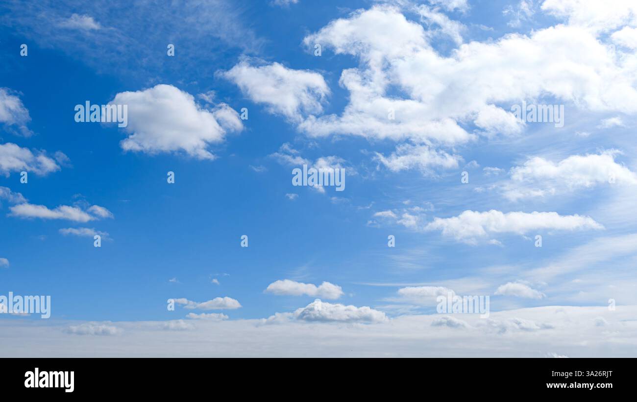 Soft white clouds in a blue morning sky Stock Photo