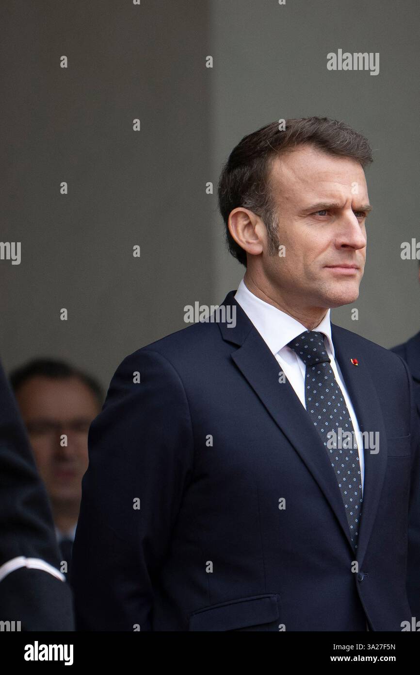 France's President Emmanuel Macron smiles and gestures at Elysee Palace ...