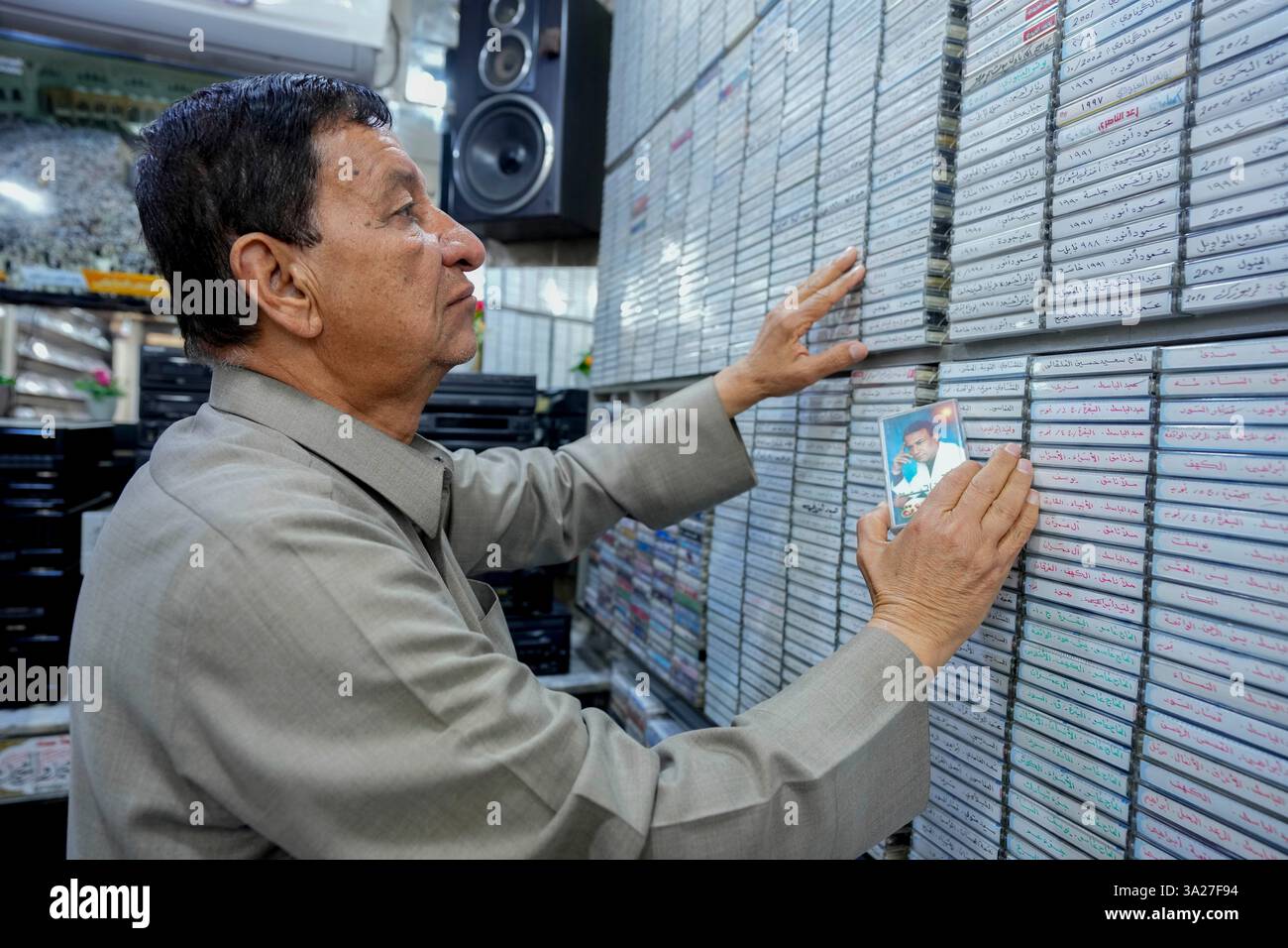 Abo Haidar, 65 years old, places music cassette tapes that are