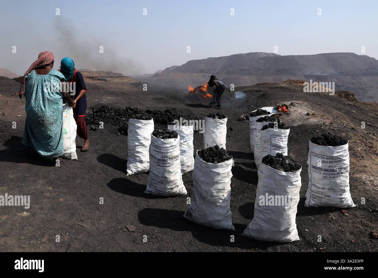 Coal mines of Jharkhand, India Coal scavengers L, fill and arrange ...