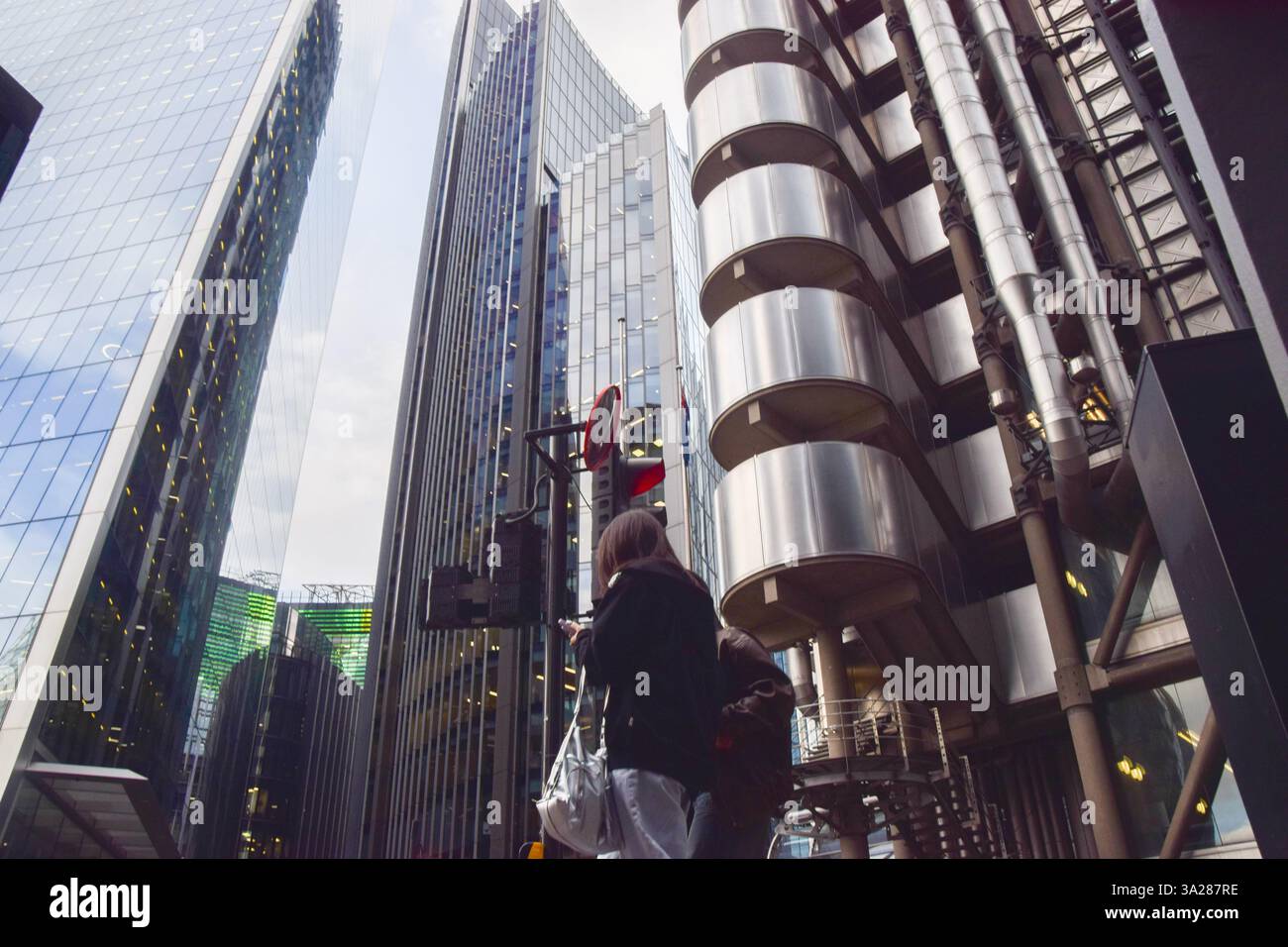 London, England, UK. 12th Mar, 2025. People walk past the Lloyd's ...