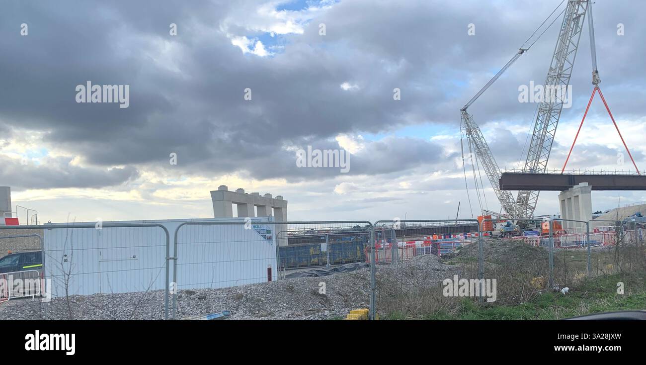 Electric electrical HS2 crane building road bridge Northamptonshire Daventry line blocks weather men man workmen large scale building tunnel - Smartphone Captured Stock Image