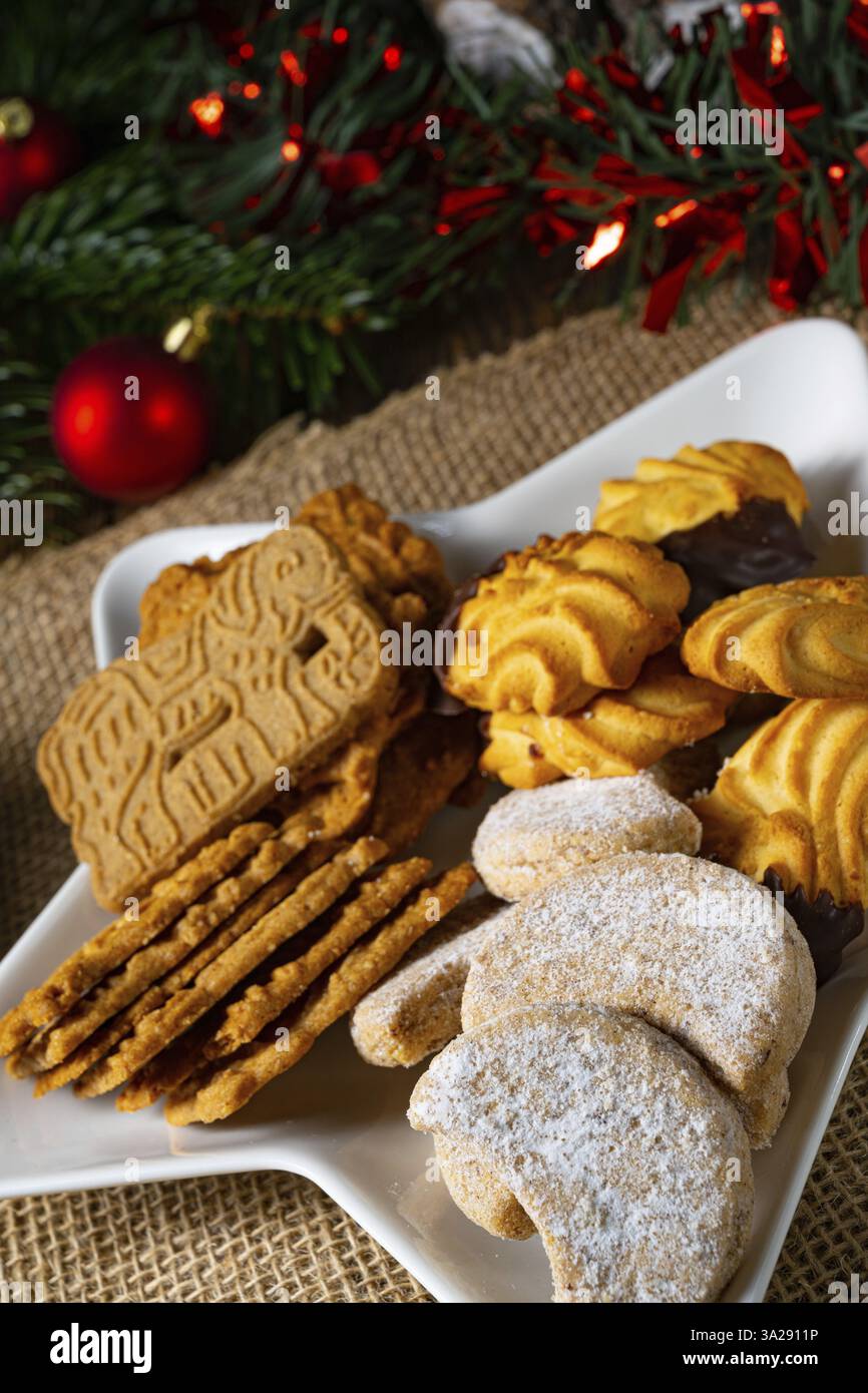 Different types of biscuits with rustic Christmas decorations Stock Photo