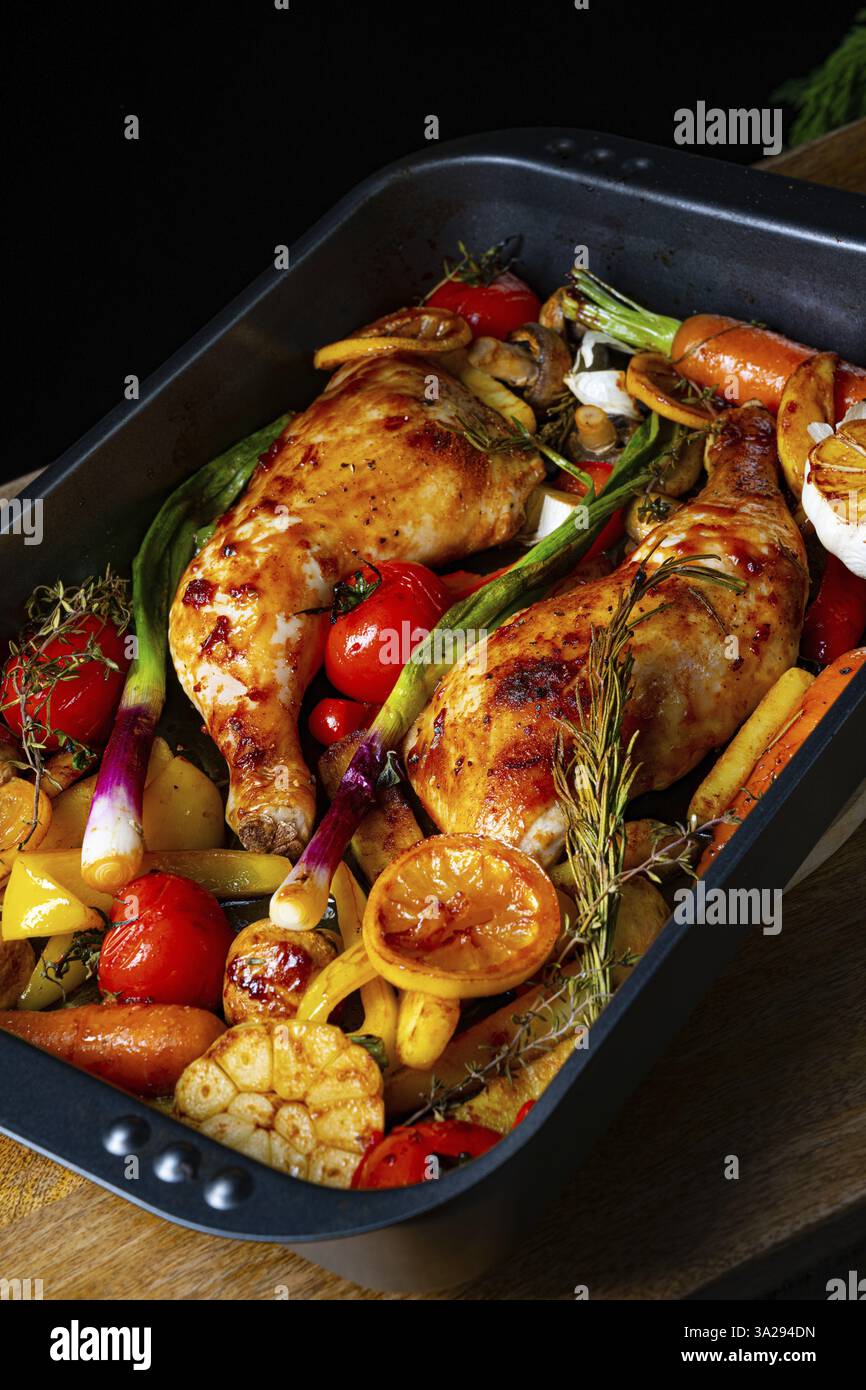 Roasted chicken legs with various vegetables Stock Photo - Alamy