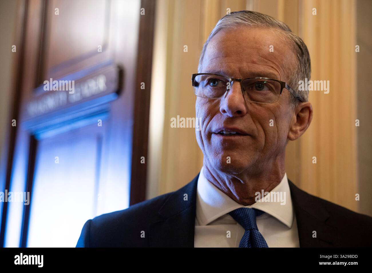 Senate Majority Leader John Thune (R-S.D.) speaks with a reporter ...