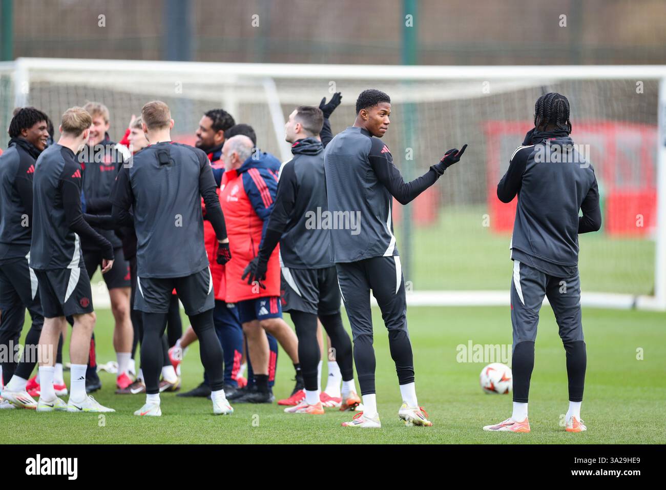 Manchester, UK. 12th Mar, 2025. Manchester United forward Chido Obi-Martin (56) gestures during the Manchester United Training session ahead of the UEFA Europa League Round of 16, 2nd Leg match vs Real Sociedad, Carrington Training Centre, Manchester, England, United Kingdom on 12 March 2025 Credit: Phil Duncan/Every Second Media Credit: Every Second Media/Alamy Live News Stock Photo