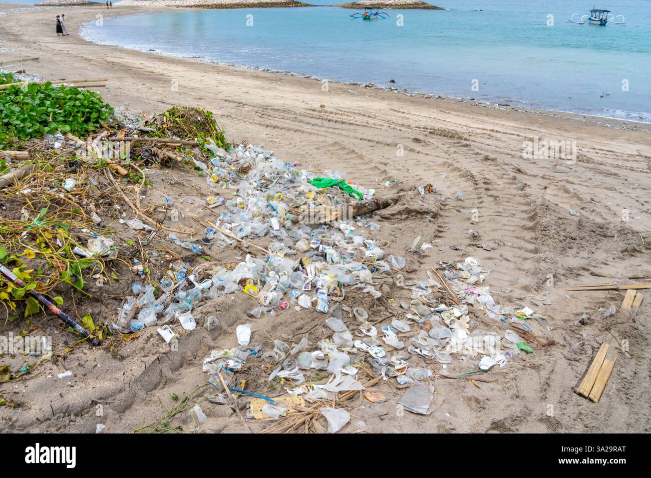 Bali, Indonesia - January 5, 2025: The tide of plastic (Marine litter) on the beach. Stock Photo
