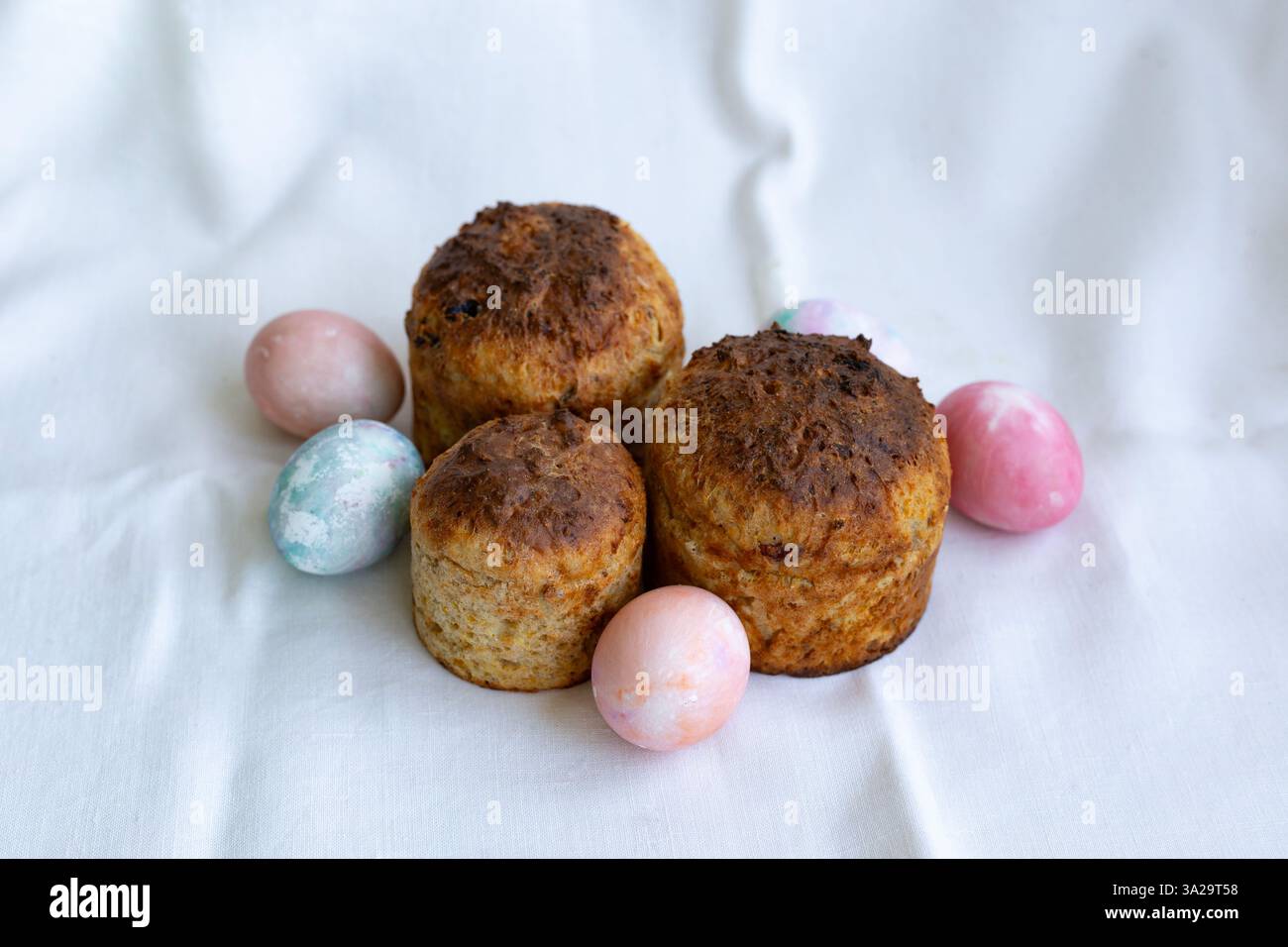 three whole wheat Easter cakes and Easter eggs Stock Photo