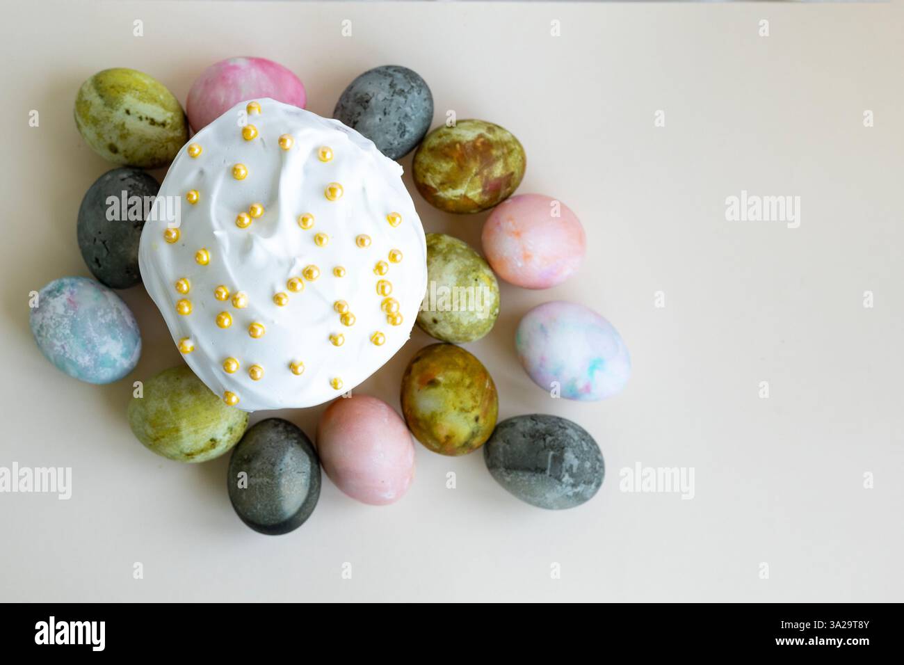 Easter cake with white icing and Easter eggs, top view Stock Photo