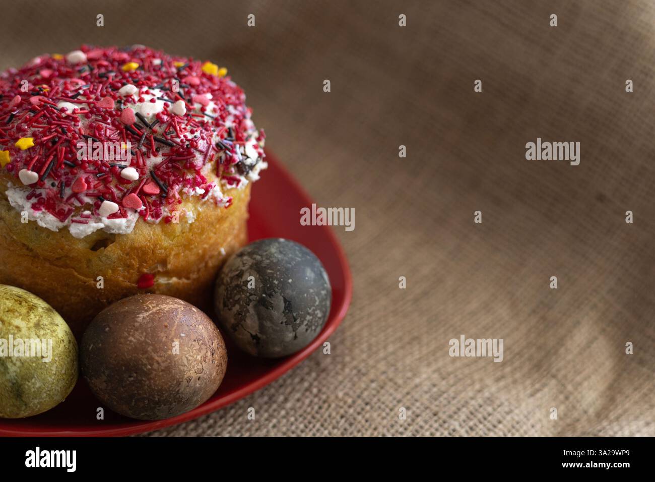 Easter cake with two Easter eggs in a red plate Stock Photo