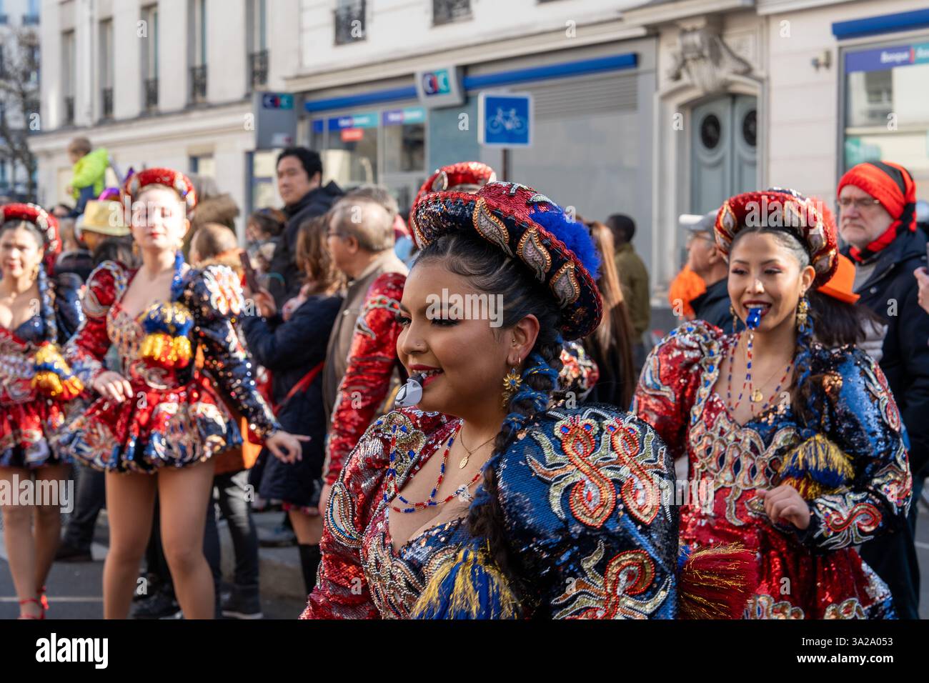 Vibrant dancers adorned in colorful costumes celebrate joyfully at the ...