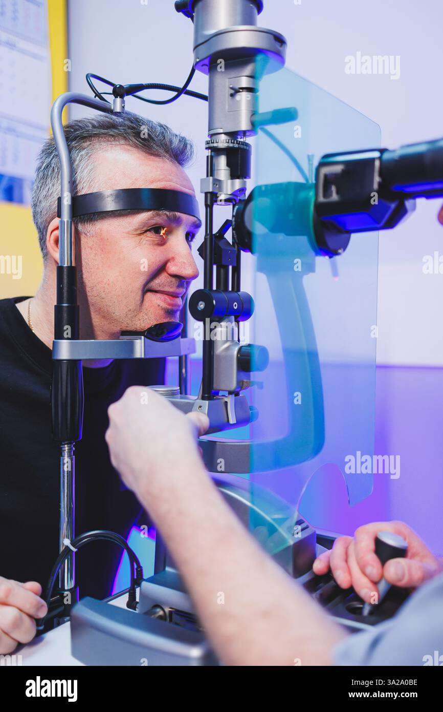 Microscope Vision Check Checking a man's vision with a modern microscope at an appointment with ...