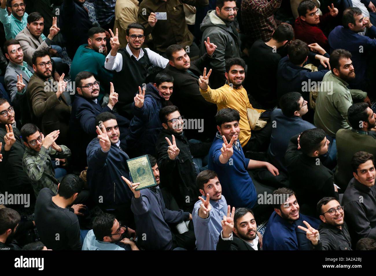 March 12, 2025, Tehran, Iran: Iranian male students flash victory signs