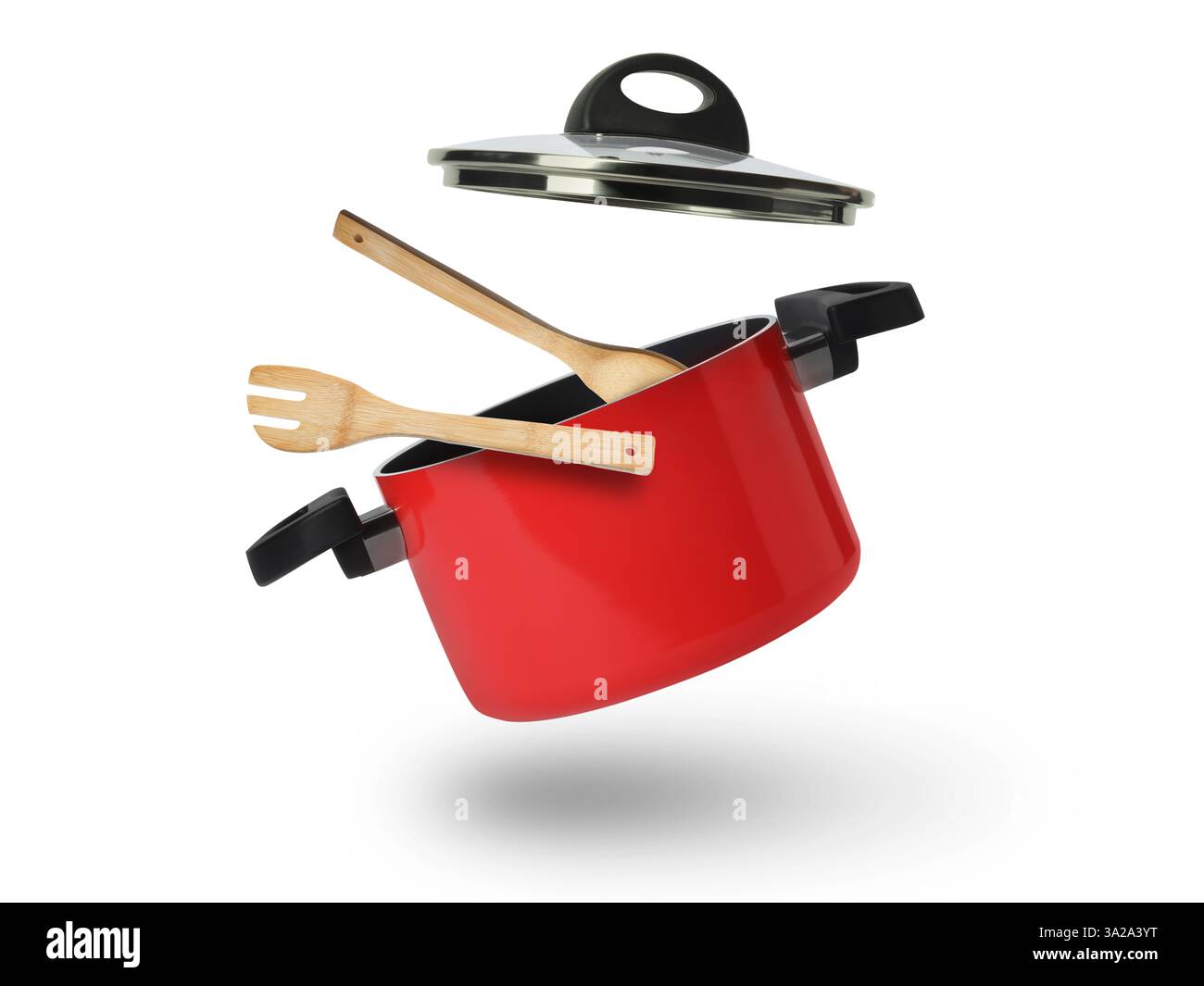 Saucepan, wooden spoon and turner in air on white background Stock ...
