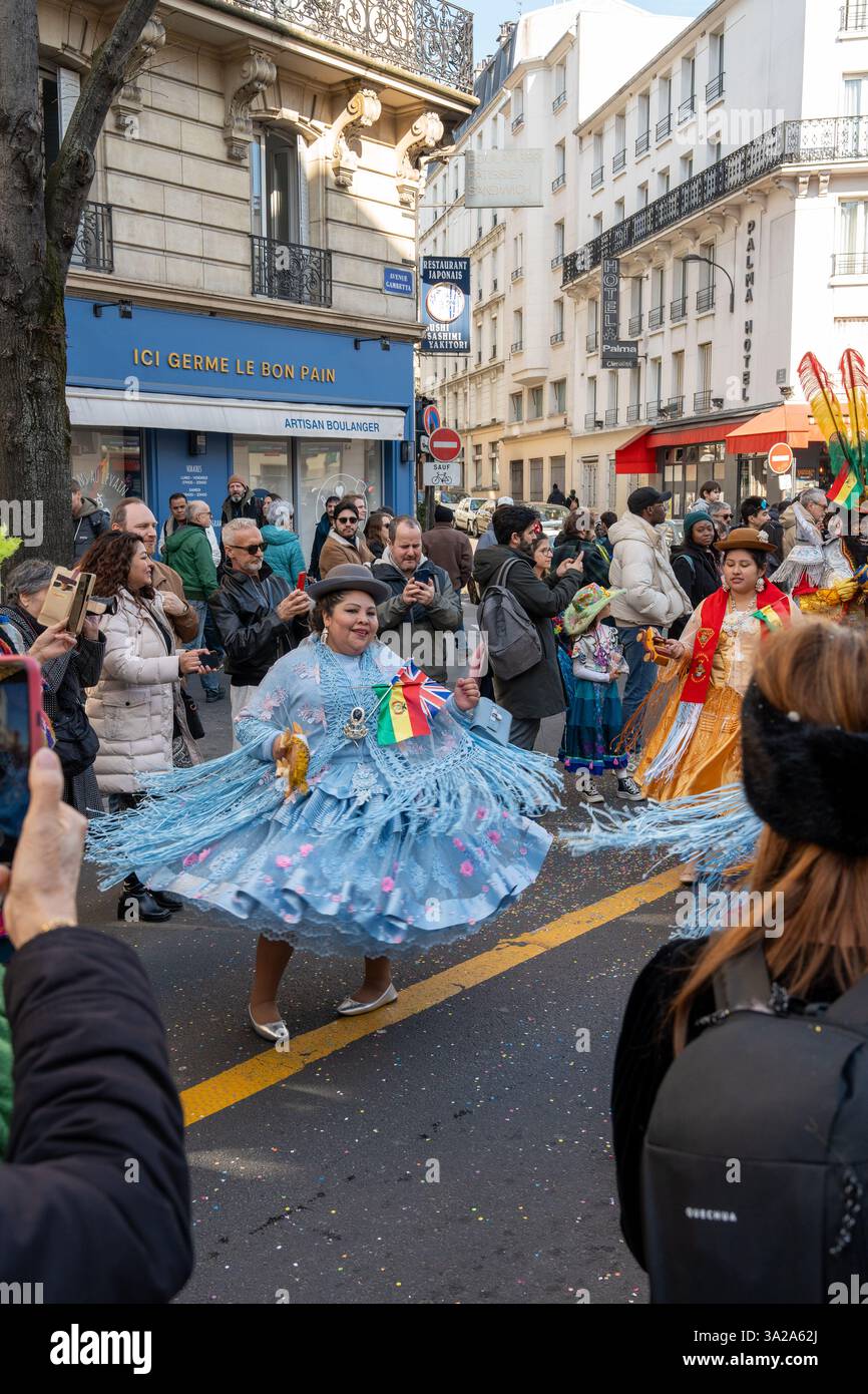 Joyful dancers celebrate in colorful costumes during the vibrant Paris ...