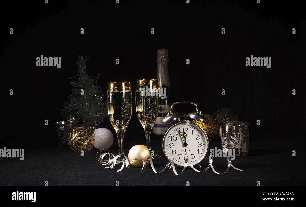 New Year's motifs clock, glasses and confetti Stock Photo