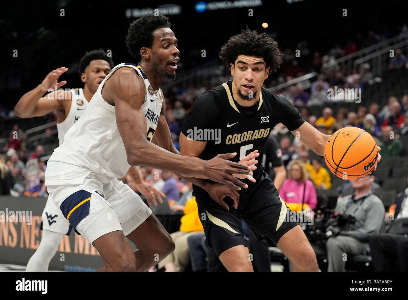 Toby Riley Smith Kc Colorado's RJ Smith, right, drives past West Virginia's Toby Okani ...