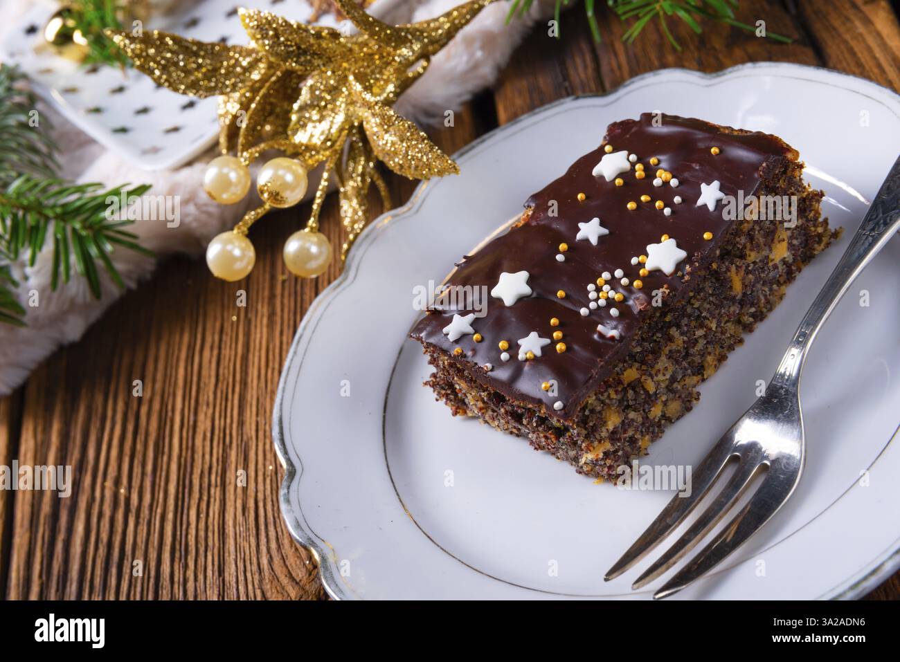 Christmas poppy seed cake with chocolate, nuts and sultanas Stock Photo