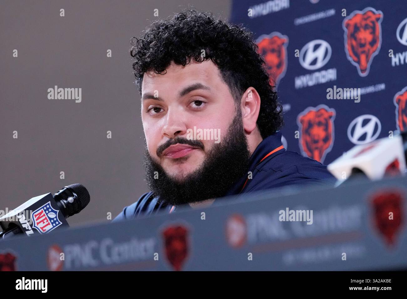 Chicago Bears football guard Jonah Jackson listens to media during a