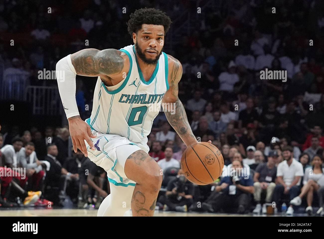 Charlotte forward Miles Bridges (0) dribbles the ball during the second half of an NBA
