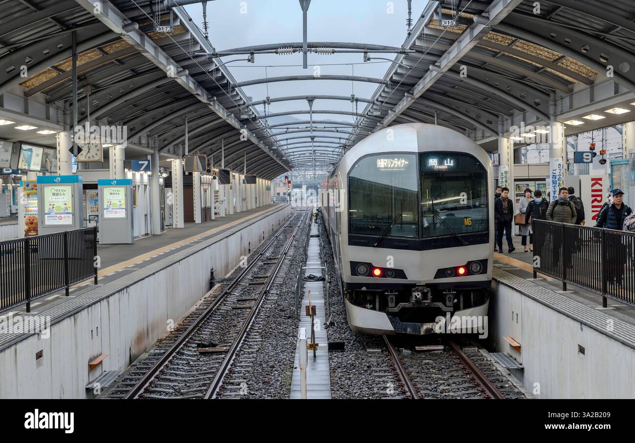 A JR West and JR Shikoku 223-5000 Series train at Takamatsu Station in Kagawa Prefecture, Japan. Stock Photo