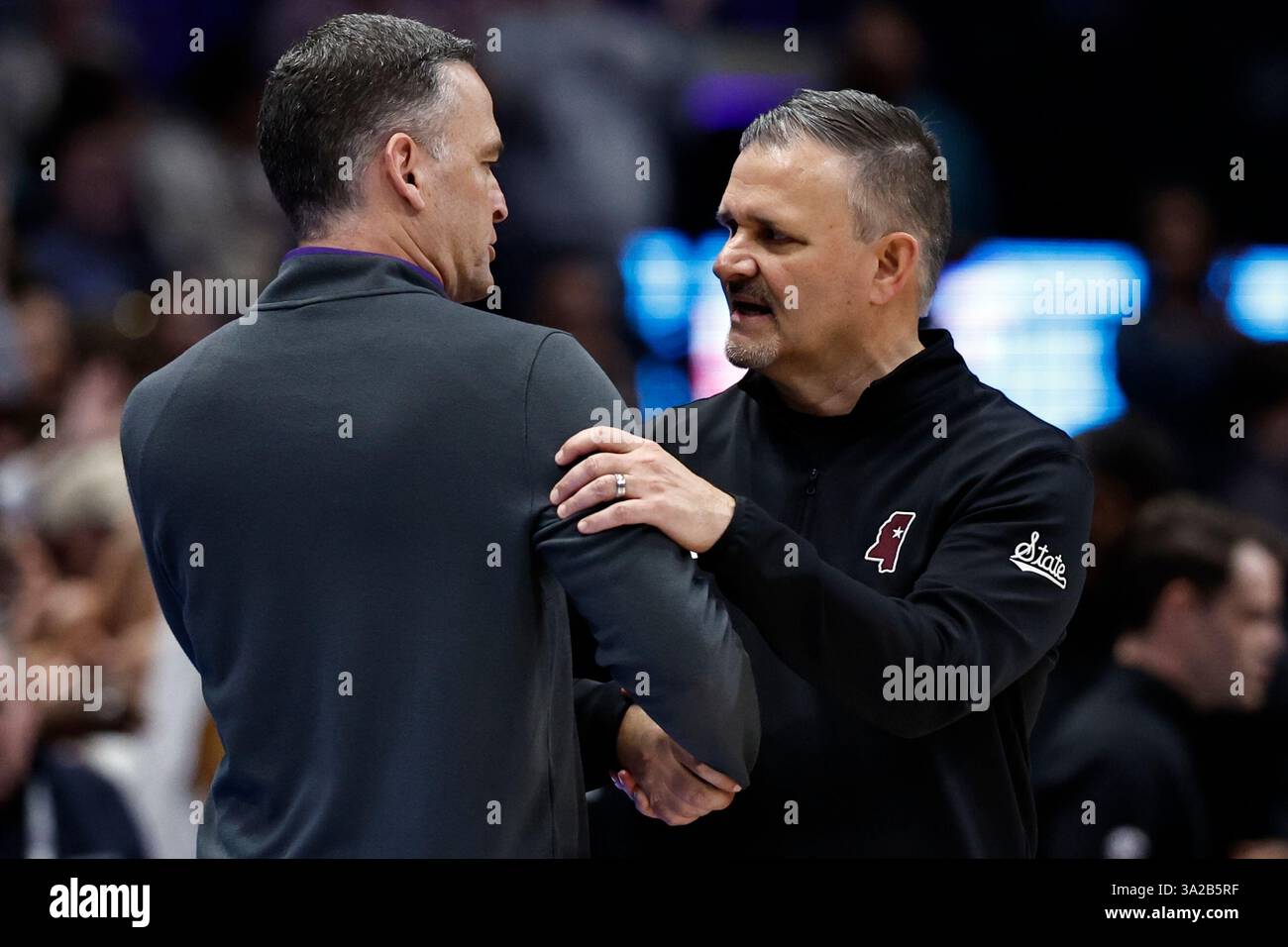 Mississippi State head coach Chris Jans, right, speaks with LSU head ...