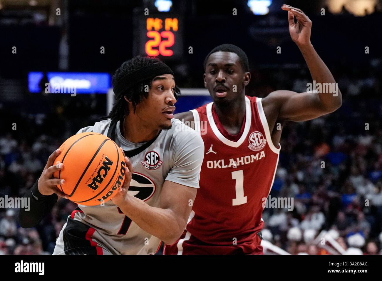 Georgia guard Tyrin Lawrence (7) moves past Oklahoma guard Kobe Elvis ...