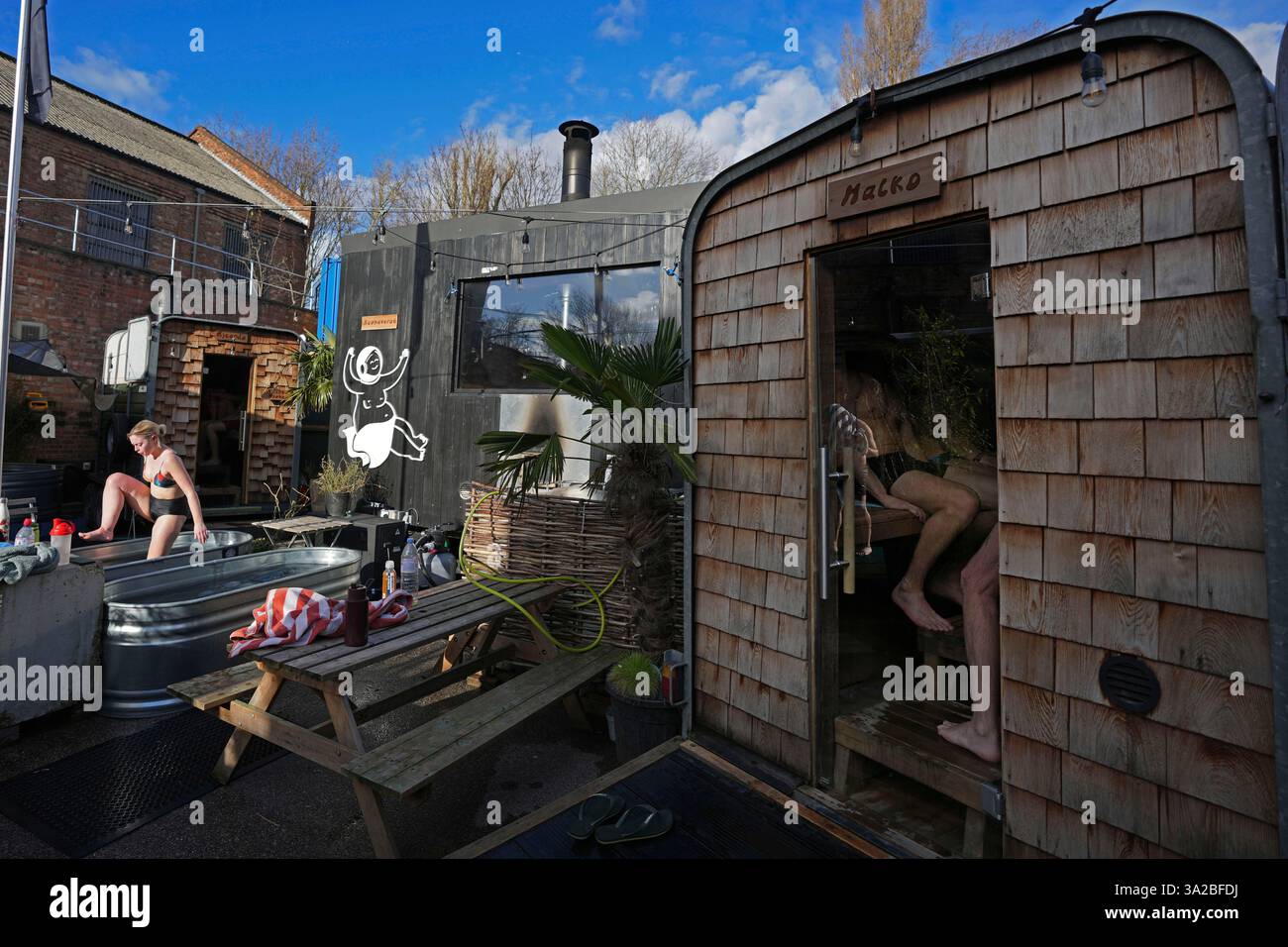 Visitors enjoy their sauna session at the Hackney Wick Community Sauna Baths, in London, Tuesday