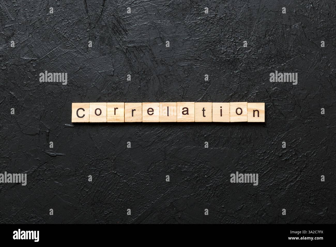 correlation word written on wood block. correlation text on table ...