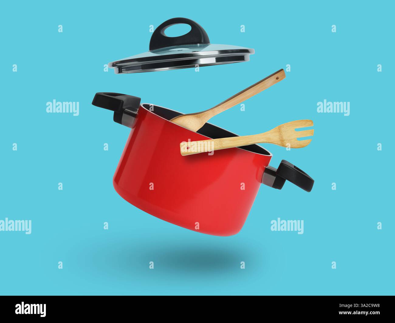 Saucepan, wooden spoon and turner in air on light blue background Stock ...