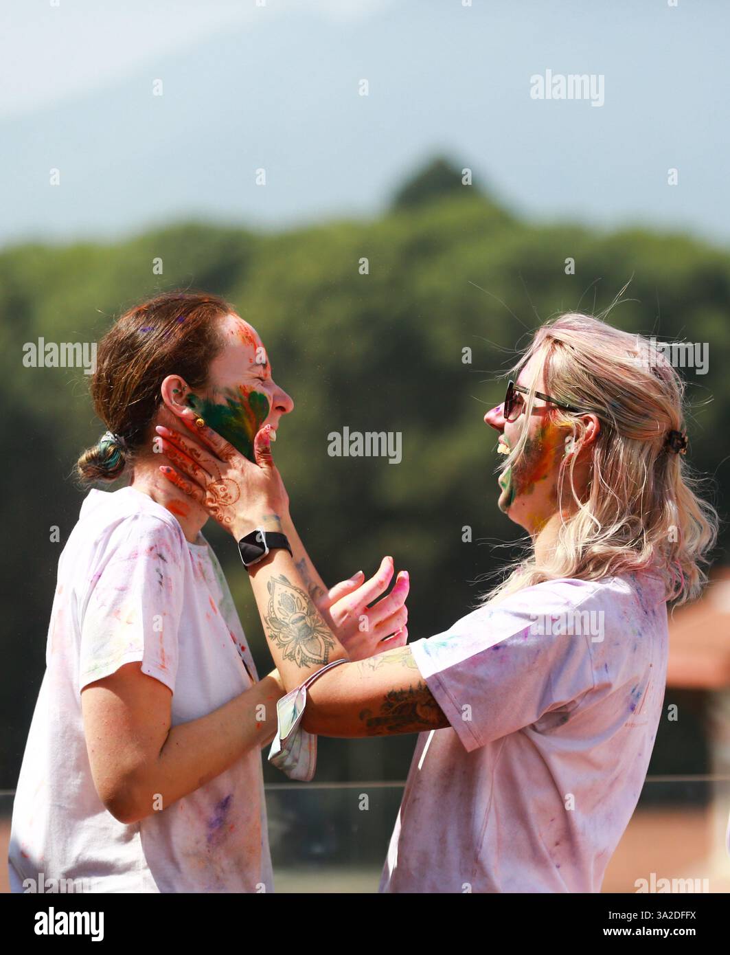 March 13, 2025, Kathmandu, Nepal: Foreigners apply color powders to